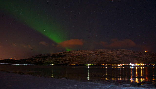The Northern Lights as seen from the fjord in Alta.